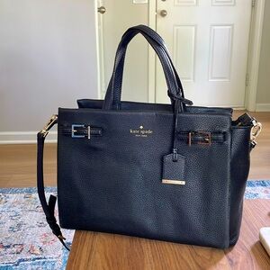 Used but refurbished Kate Spade purse. Gold detailing with black leather.